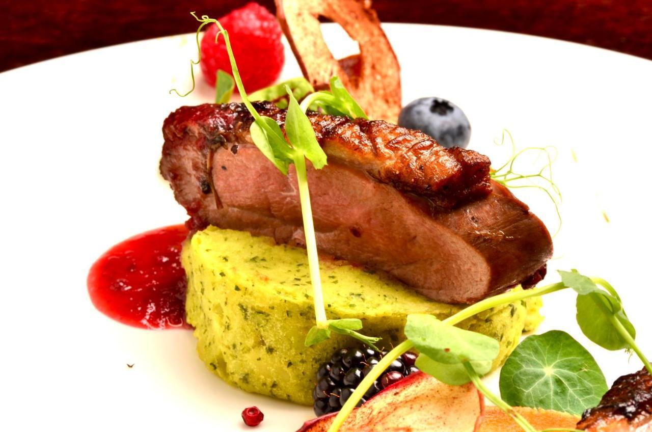 Hotel Grodek Kraków Exteriör bild A duck confit dish